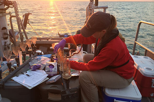 A CIGLR researcher processing samples on board a ship